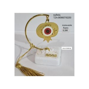 ρόδι με ματάκι σε ημικύκλιο πάνω σε βότσαλο